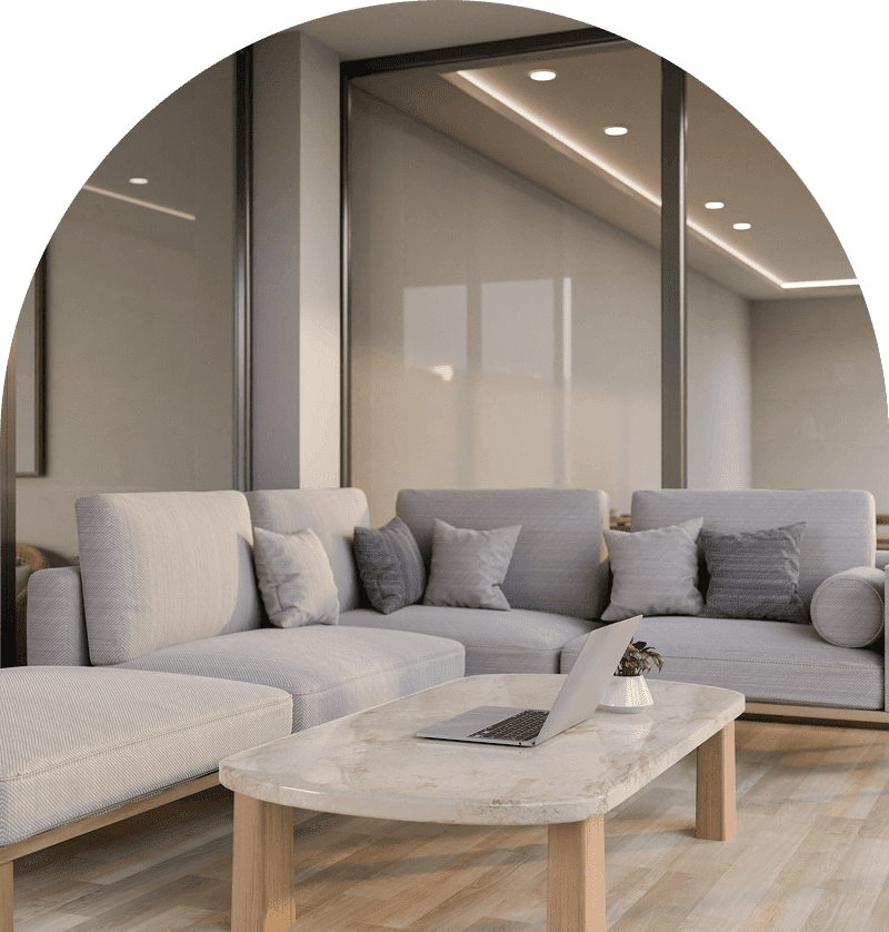 Modern living room with grey sofas, laptop.